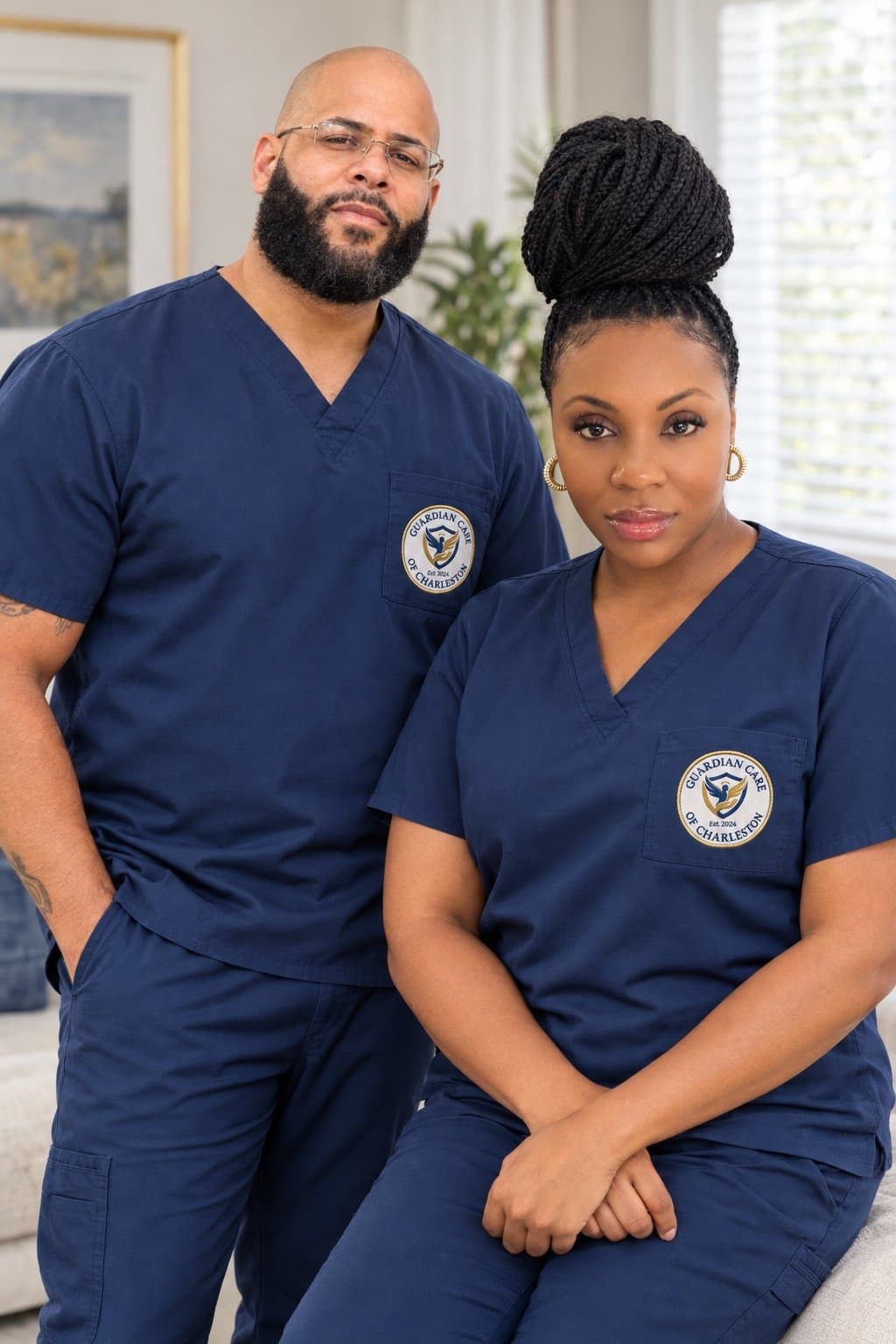 The founders of Guardian Care of Charleston in navy scrubs