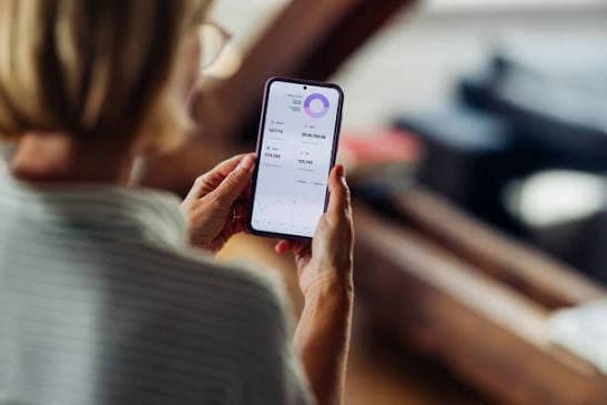 A family member checking a daily care update on her phone